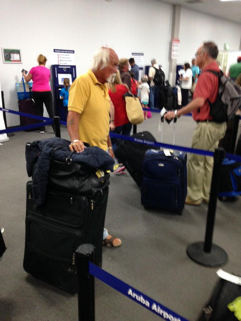 temmel's tweet image. OMG Hulk Hogan in customs line in front of me