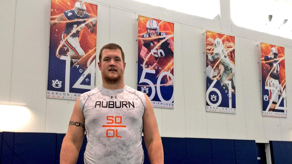 AuburnFootball's tweet photo. 2014 @rimingtontrophy winner @Dismukes50 with his new banner in the Indoor. Well deserved! #AuburnFast #WarEagle http://t.co/B3EylpbHXp