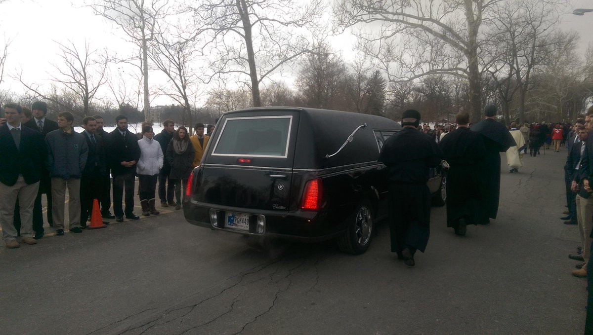NDSMCObserver's tweet photo. Fr. Ted’s hearse passes students on the road to Holy Cross Community Cemetery http://t.co/zFN4XEDHEo