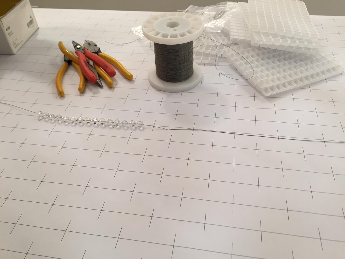 TheLightingLoft's tweet photo. Step 3: The long, tedious process of stringing the crystals on each strand. http://t.co/6LKsG32zeO