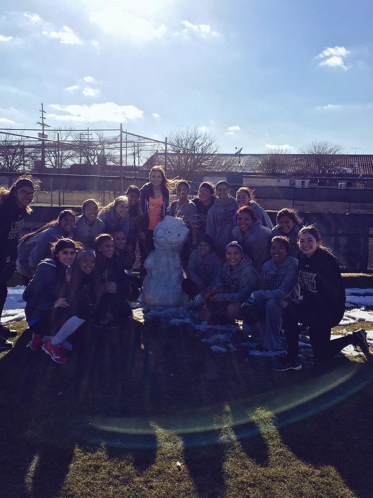LHS varsity softball girls with their mascot RJ