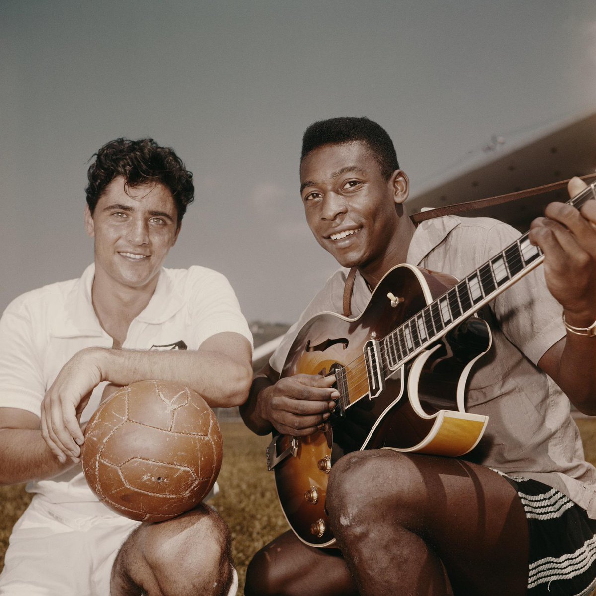 FIFA World Cup - Pelé plays an acoustic guitar surrounded by teammates at a  training session in Paineiras, before Confederação Brasileira de Futebol  leave for England to play in the 1966 World