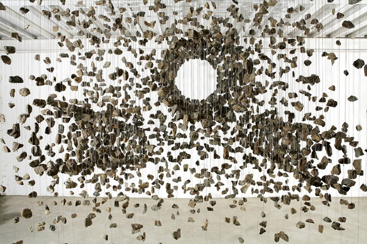 Artist Jae-Hyo Lee configures stones in hanging installations.