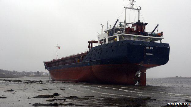 BBCScotlandNews's tweet photo. Efforts are being made to refloat a cargo ship which ran aground on the west coast of Scotland http://t.co/JDalMPdlBt http://t.co/peXWR4lJ9W