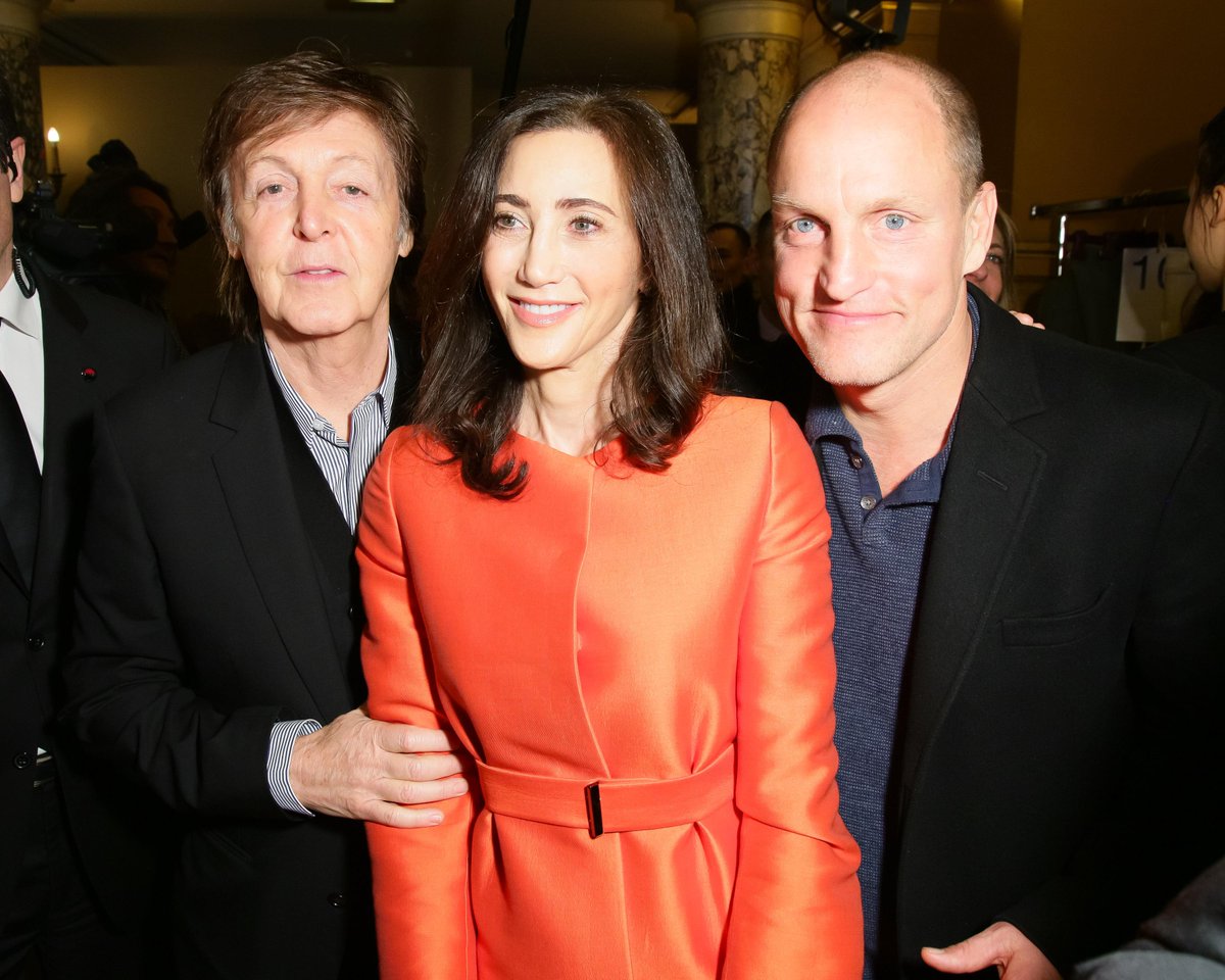Who was the woman in red next to Sir Paul at PFW today? NJ trucking(04)