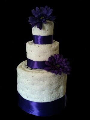 ArcTextiles's tweet image. Pretty impressed with this towel wedding cake. Probably not very tasty, though.