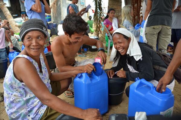 bradey_boy's tweet photo. Smiles all-round - checking out the contents of #ADRA's water and hygiene kits. #adraresponds #Haiyanc http://t.co/95i1UZCK58