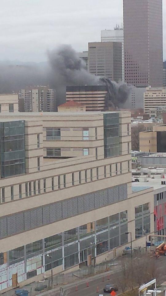 DenverChannel's tweet photo. Smoke from #DowntownFire in #Denver. Photo from @tarin7news. Firefighers working #BreakingNews http://t.co/XzzGnNUkos http://t.co/reNFI5xfKA