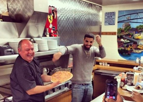 GuyFieri's tweet photo. My brutha @drake cookin' it up Nikos &amp; Sikey at Voula's Offshore Cafe tonight. http://t.co/9wT7J7BOaY