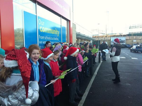 CurrieLiz's tweet photo. @Broadwater2202 100 local school children singing carols outside the store today- very Christmassy! http://t.co/UTNBq5f8er