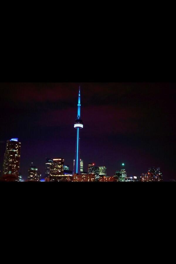 TorontoPolice's tweet photo. MT @AgentTrinaOwens: via @BeckTaxi: CN Tower was glowing blue Dec9 in memory of Cst John Zivcic #RIP9824 #Respect http://t.co/GZm0shRwDf ^sm