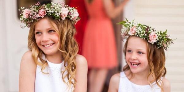 HuffPostWedding's tweet image. Flower girls in flower crowns. Is there any other way? (Credit: Nicole Ryan Photography/@theknot)