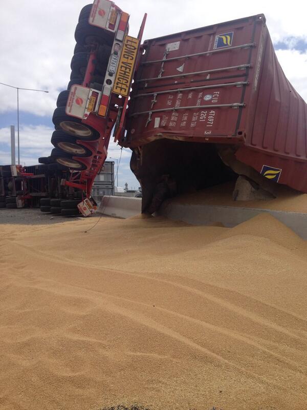 theage's tweet photo. RT @DougalBeatty: Big hole in truck container, spilling grain all over #BolteBridge on-ramp http://t.co/E3YHMRpI2K