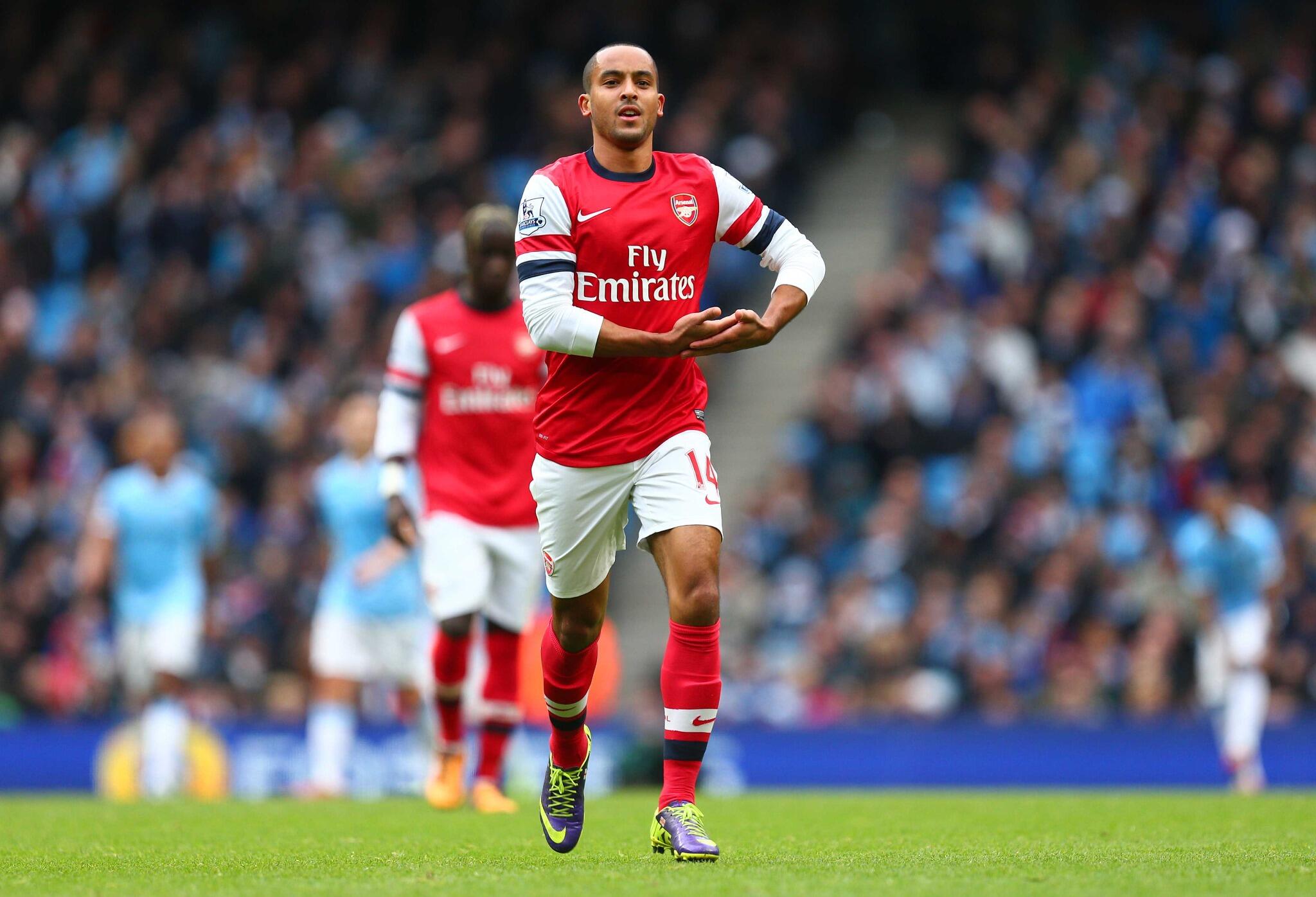 Theo Walcott does Bebeto baby-rocking goal celebration v Man City with bambino on the ...