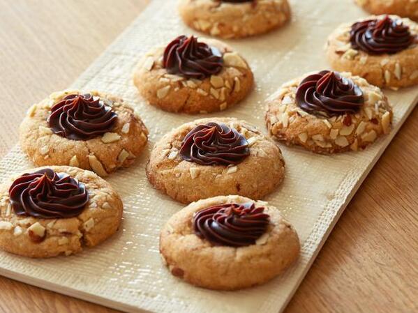 FoodNetwork's tweet image. And now for the fan-inspired Chocolate Almond Butter Thumbprint Cookies: bit.ly/1fdR6p4. #12DaysOfCookies