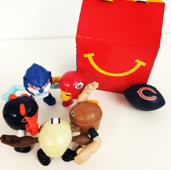 McDonalds's tweet photo. We found some tough #NFLRushZone toys huddled up in McDonald’s #HappyMeals – take a look! http://t.co/lgigVxPQW2