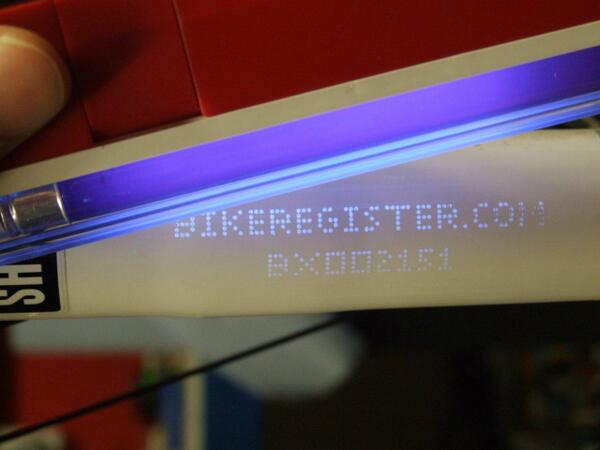 DurhamPolice's tweet photo. The bike security marking only shows up under UV light, it's invisible to the naked eye. http://t.co/Ptxtx3xLzv