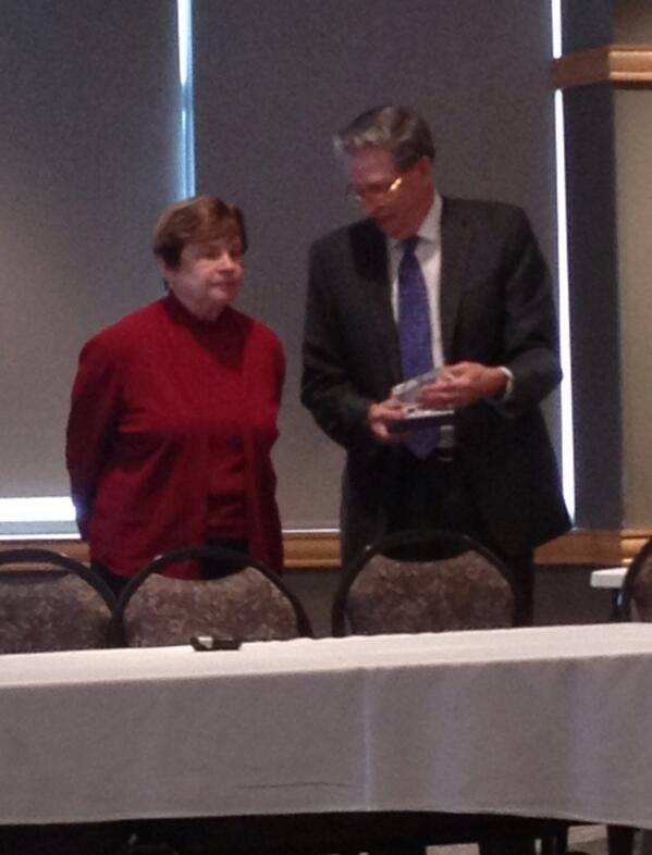 Mayor Jim Hovland presents the 2013 MLC Legislator of the Year to State Senator Ann Rest.