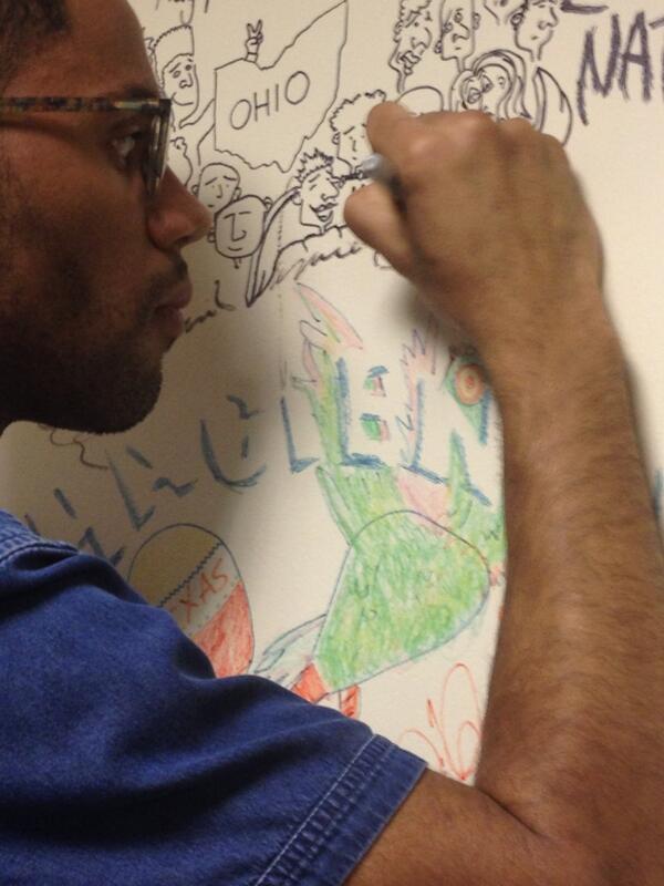 Kwesi K signing the wall <a href="/WXPNDanReed/">Dan Reed</a>