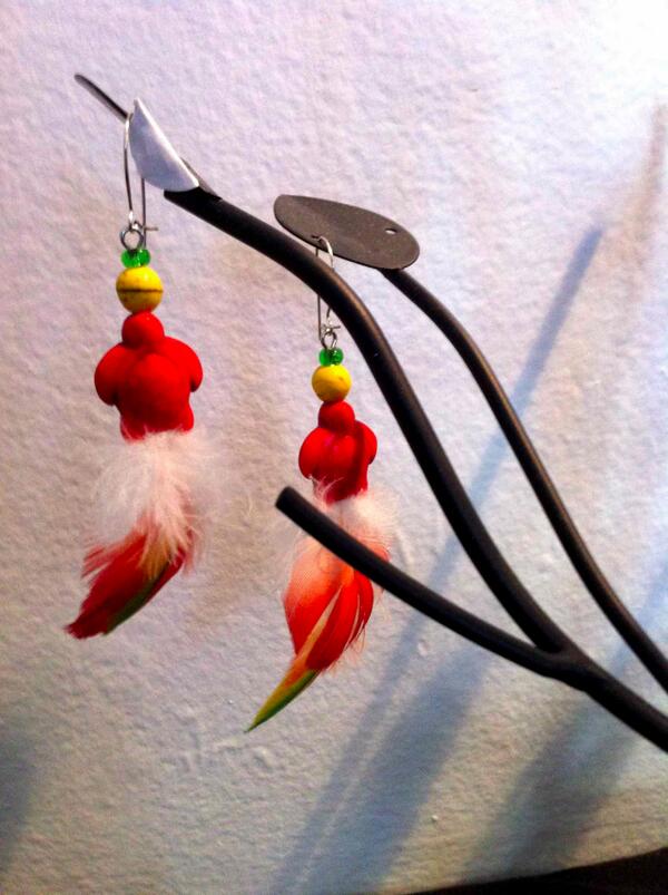 Feather earrings for the party. #OneOfAKind #MadeLocal