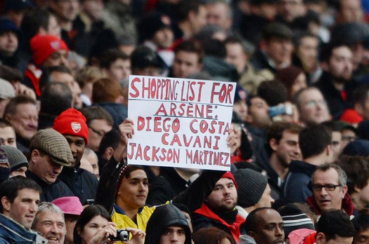 Bc50satIgAApO a Costa, Cavani & Martinez! Arsenal fan brings a banner shopping list to Cardiff match [picture]