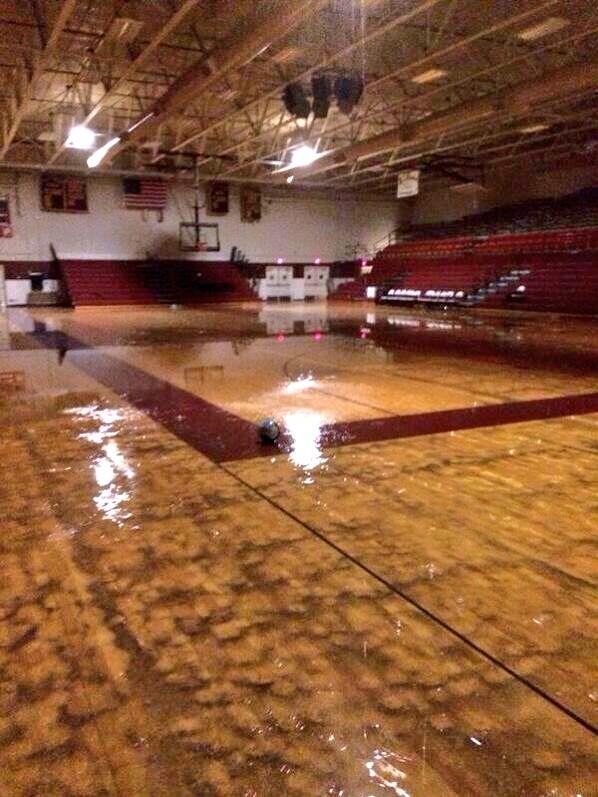 BrandonNews25's tweet photo. PHOTO: As we showed you at 10 the roof at McLean County High School was damaged in the storm. The gym is flooded. http://t.co/6ACNlpW1KJ
