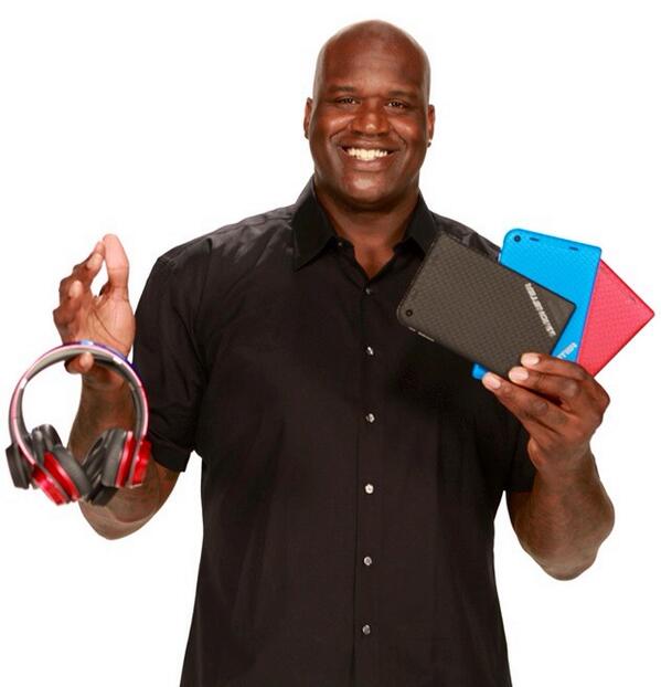 Tablets look like credit cards in Shaq's hand. "
