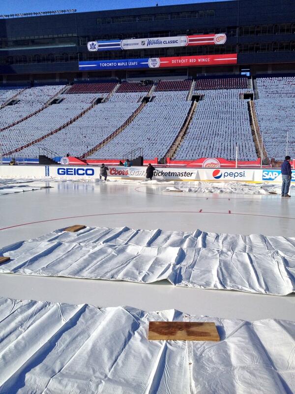 NHL's tweet photo. Next task on the #WinterClassic rink: dasher board logos. http://t.co/Rx81HT8uMQ