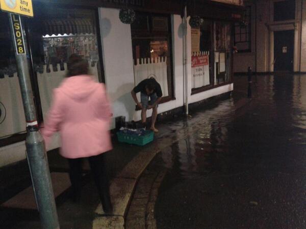 WestCountry_Ltd's tweet photo. #Cornish Storms no match for our dedicated drivers (note rolling up of trousers) http://t.co/1y6BHYqDN0