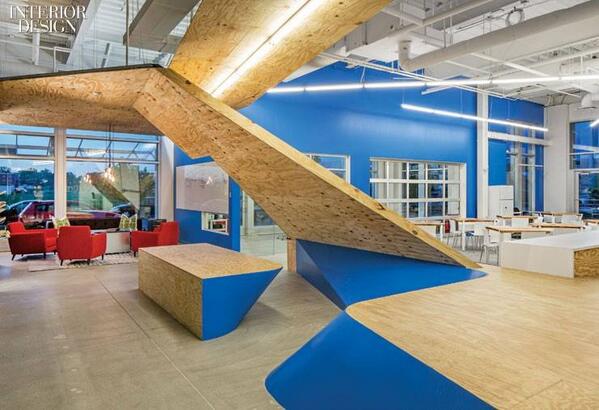 A canopy of construction-grade plywood separates a break-out area from a café <a href="/tackarchitects/">TACKarchitects</a>: bit.ly/1iq24fw