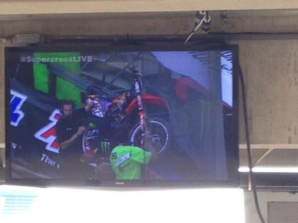 Talkmx's tweet photo. There's a motorcycle stuck in the foul ball net http://t.co/J9tlIIheKO
