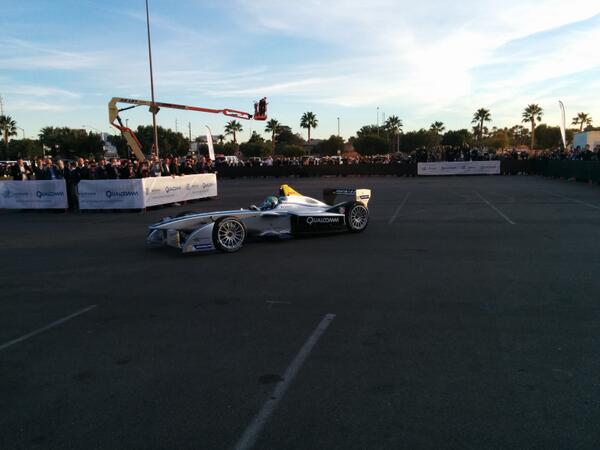Qualcomm's tweet photo. Here's @LucasdiGrassi taking the @FIAformulaE car for a spin. #bornmobile #chargeuplasvegas http://t.co/CQK31ReOBc