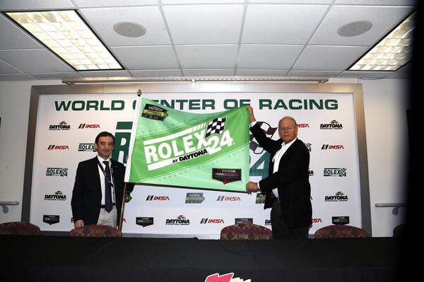 Jim France presents ACO president Pierre Fillon w/ "The most spectacular green flag waved at Dayona to start a race."