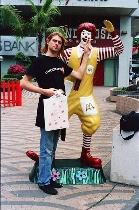 HistoryInPics's tweet photo. Kurt Cobain giving Ronald McDonald a cigarette in Singapore, 1992 http://t.co/EZ48fFnnmj