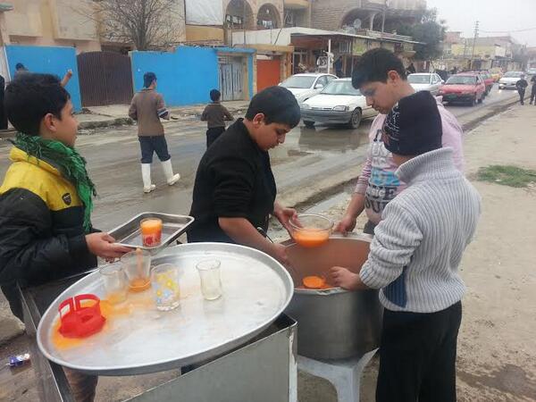 Brightiraq's tweet photo. Children hand out juice and sweets to celebrate the Prophet's birthday (Mawlid Al-Nabawi) in #Mosul, #Iraq http://t.co/oh8M6sXNCG