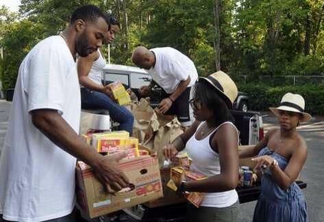 #TBT Stocking up the shelves at the Helping Hand of MB in 2012