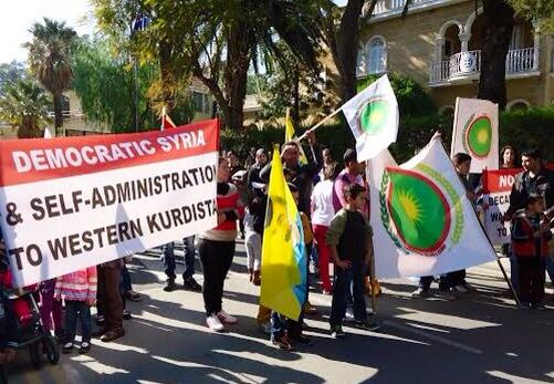 mutludc's tweet photo. 'Democratic Syria & Self-Administrayion to Western Kurdistan' frm a Kurdish demo in Cyprus #StatusForKurdsAtGenava2 http://t.co/svxFqVGa75