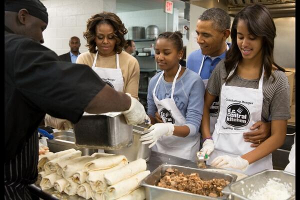 BarackObama's tweet photo. ICYMI: The first family honored #MLKDay by volunteering at the DC Central Kitchen (@DCCK). http://t.co/a0oU1XEKMn