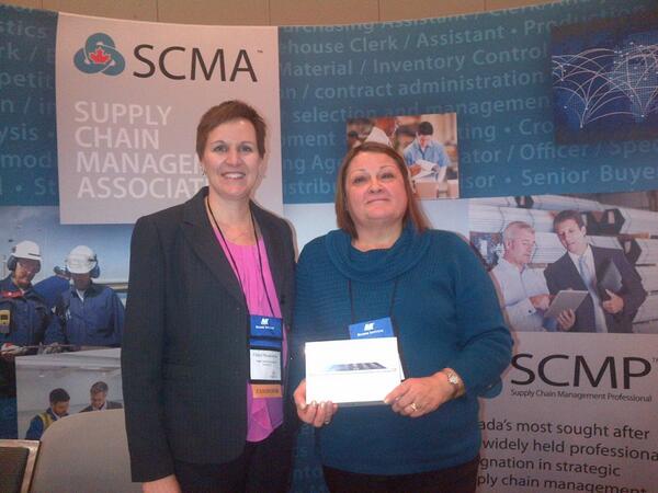 scmaceo's tweet photo. #cannexus14  Prize winner Margaret Purdy from NWT gets her new iPad mini - Supply Chain Management Association booth http://t.co/LGM3YW4TXi