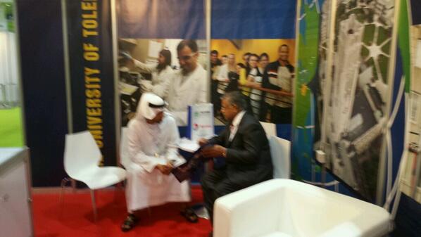 Dean Naganathan  talking to prospective graduate student at World Future Energy Summit.