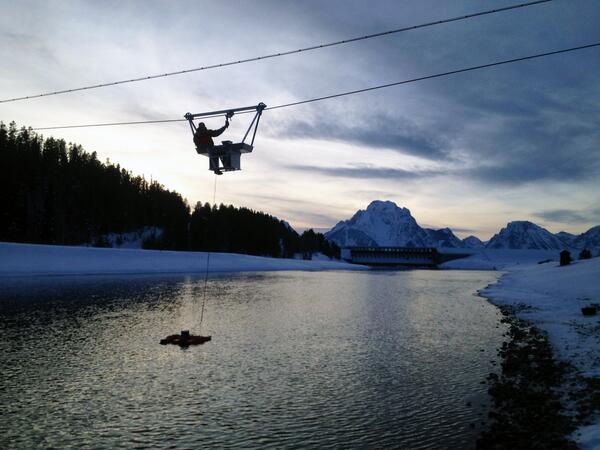 USGS's tweet photo. A USGS hydrologist measuring stream discharge over the Snake River near Moran, WY (http://t.co/v6Wr3rINHw) #USGS http://t.co/l3PXtOXbQC