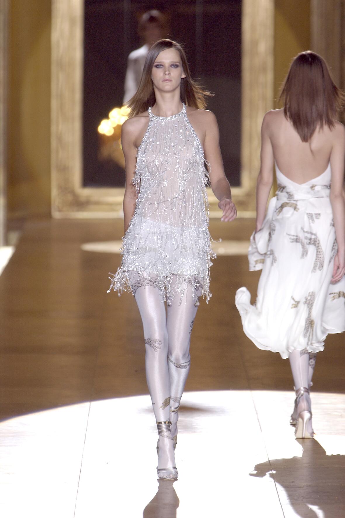 Roberto Cavalli Milan Ready to Wear S S Model Carmen Kass very long blonde  wavy hair wearing white ruffled sleeveless blouse Stock Photo - Alamy