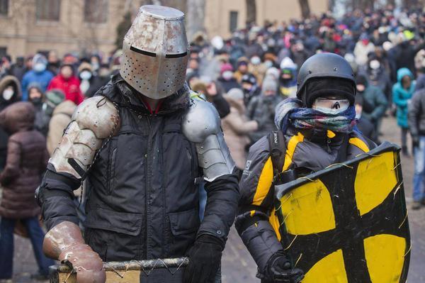 Deseret's tweet photo. In Ukraine, protests over closer ties with Russia resemble Medieval battle http://t.co/EpTco9KoJA | http://t.co/JZ76NQfjtm