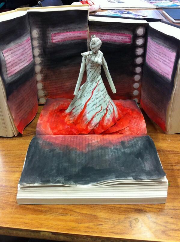 HungerGamesUK's tweet image. Secondly, we admired the creativity of the #GirlOnFire emerging from a book by @BoyWithTheToast #FanArtFriday