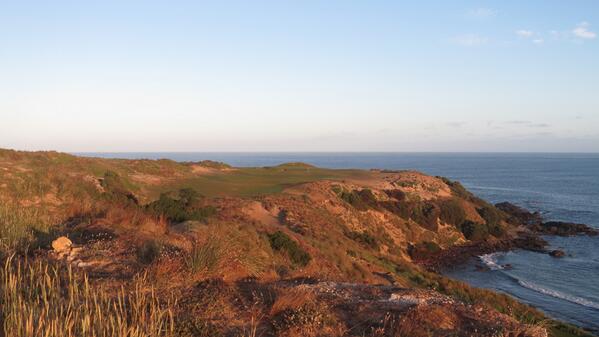 Planet_Golf's tweet photo. Sunrise over the short par 4 opening hole at Cape Wickham, as grow-in continues. http://t.co/OzQHFw4Zb4