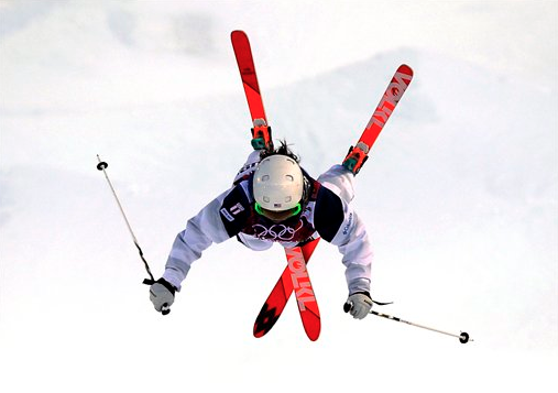 Sweet AP photo of Hamden’s Eliza Outtrim in mid-mogul flip during qualifying at Sochi today