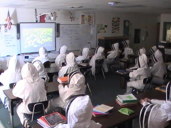 NPMSBeeProject's tweet photo. 8th grade students trying on bee suits for the first time and checking out their new Twitter account.#npsdtech http://t.co/P3mDBMj7fC
