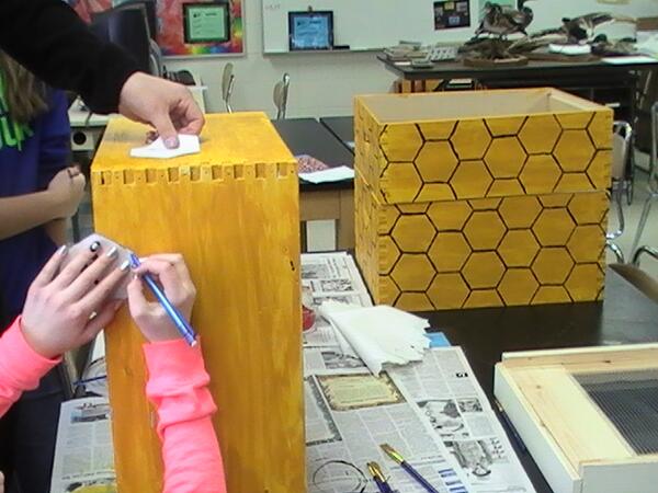 NPMSBeeProject's tweet photo. Students painting their designs on the hives. http://t.co/jW4zq1Ishd