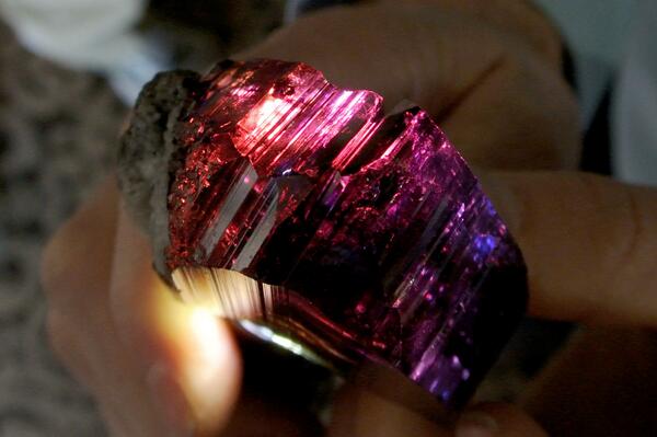 Seen at Tucson 2014, tanzanite crystal showing great c-axis direction 'red'. Want.