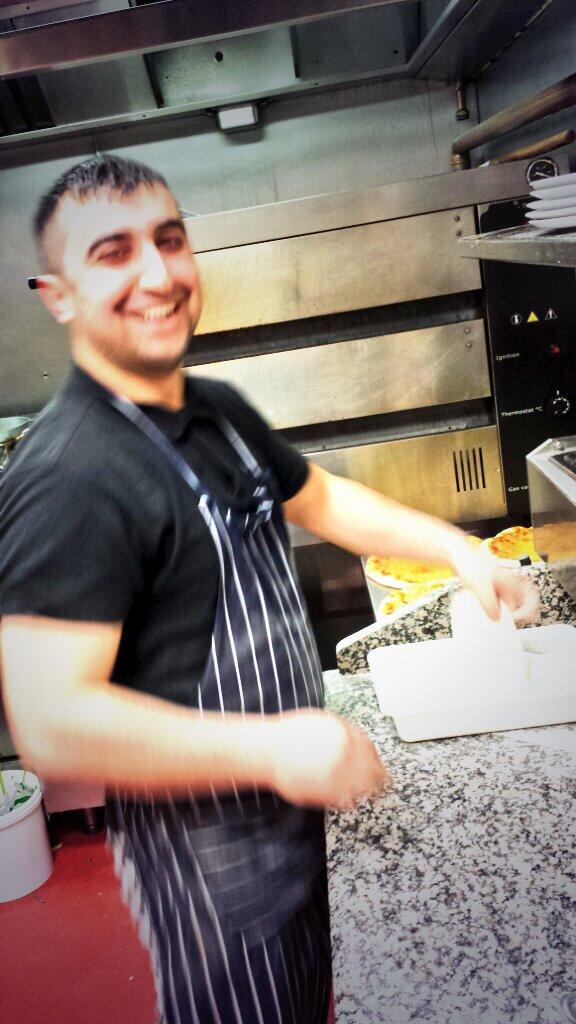 MartinosChef's tweet photo. The kitchen clown knocking up some deliciously thin hand flattened pizzas. http://t.co/3d1zI5Dr52